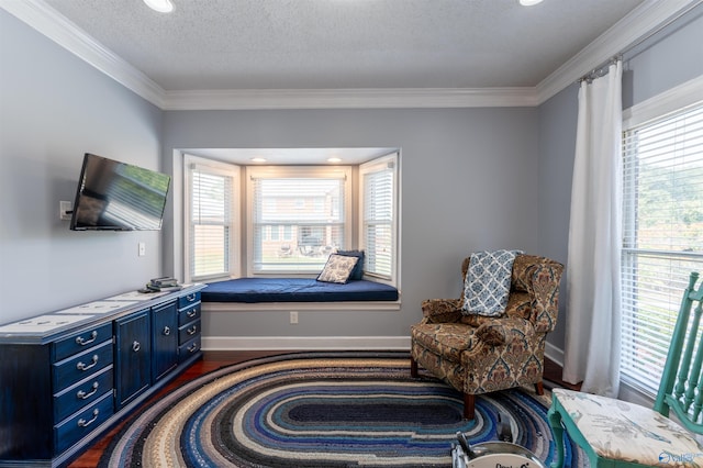 living area with ornamental molding, dark hardwood / wood-style flooring, and plenty of natural light