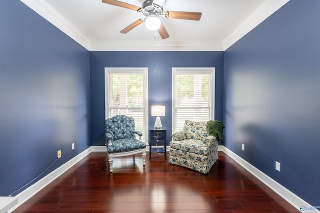 living area featuring ceiling fan, crown molding, and dark wood-type flooring