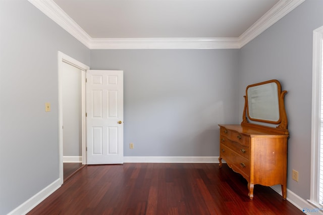 unfurnished bedroom with ornamental molding and dark hardwood / wood-style flooring