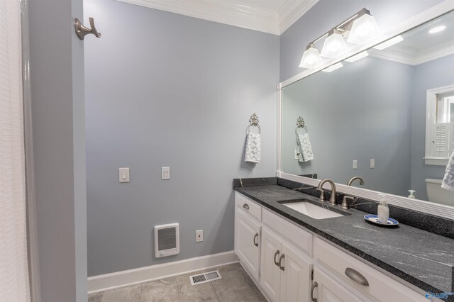 bathroom featuring vanity, tile patterned flooring, heating unit, crown molding, and toilet