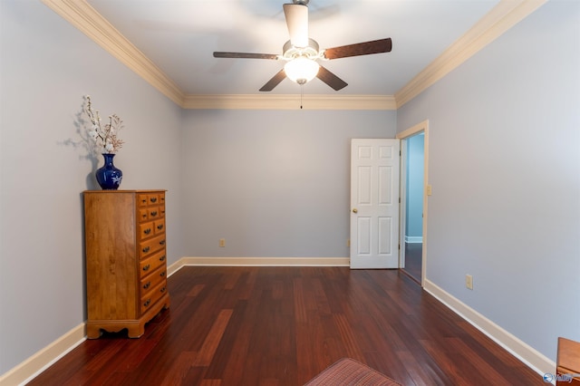 unfurnished bedroom with ornamental molding, ceiling fan, and dark hardwood / wood-style floors