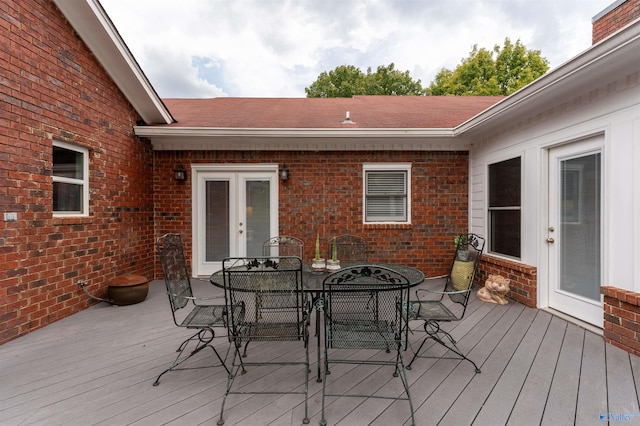 wooden deck featuring french doors