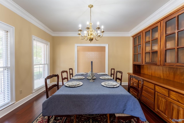 dining room with a notable chandelier, dark hardwood / wood-style floors, and crown molding