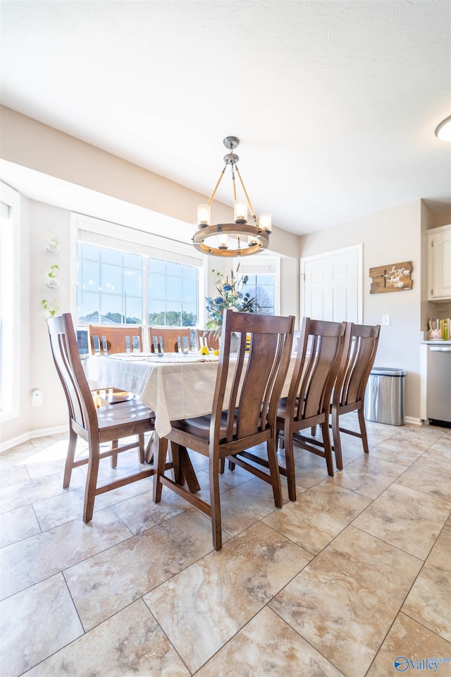 dining room featuring a chandelier