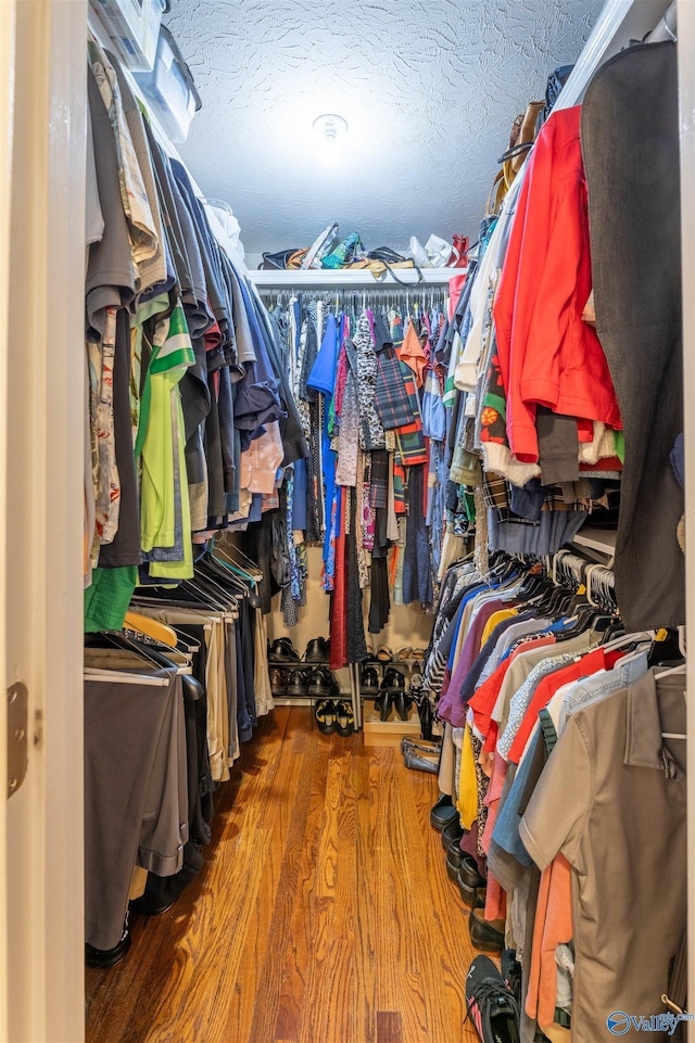 walk in closet featuring hardwood / wood-style floors