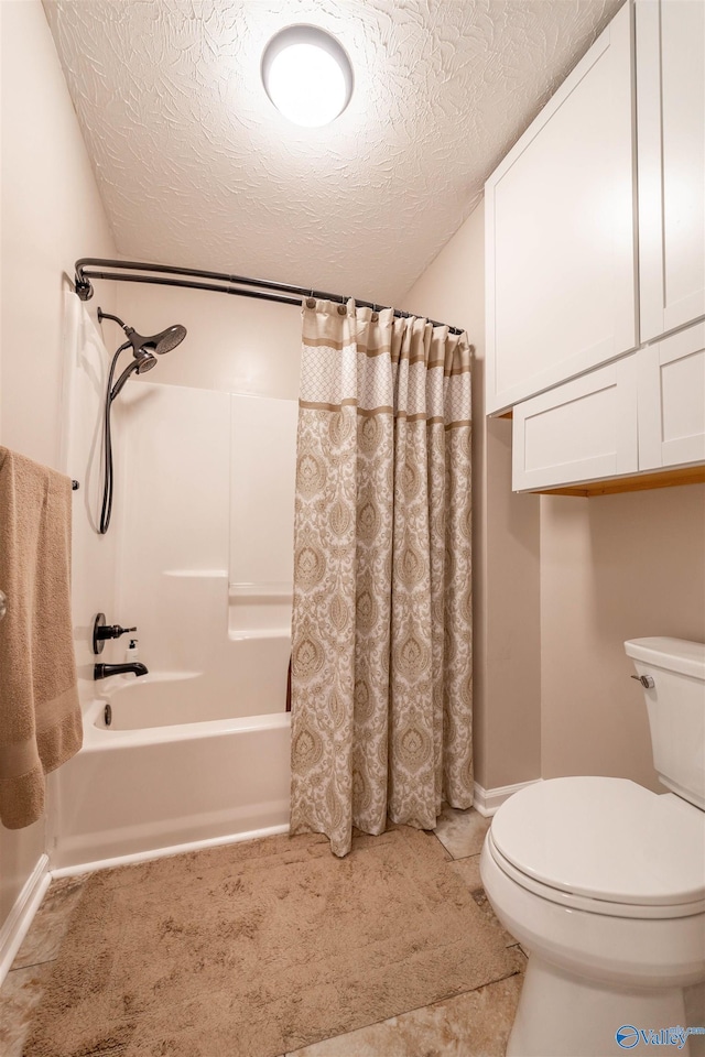 bathroom with shower / bath combination with curtain, toilet, and a textured ceiling