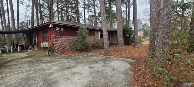 exterior space with a carport