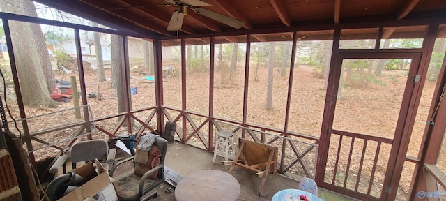 unfurnished sunroom with ceiling fan