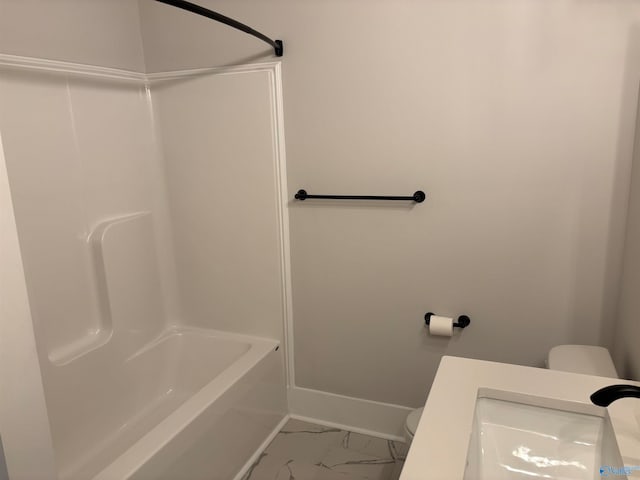 full bathroom with tub / shower combination, vanity, and toilet