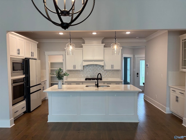 kitchen featuring pendant lighting, white cabinetry, and appliances with stainless steel finishes