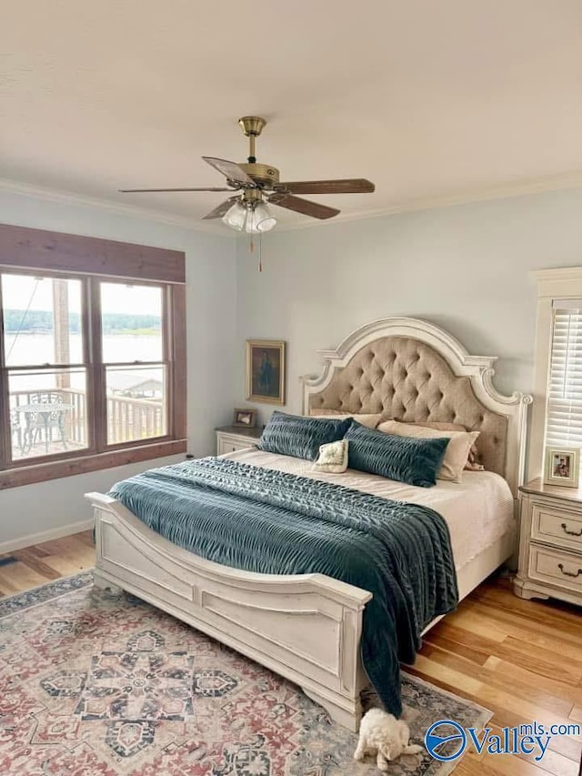 620 County Road 40, Centre, AL 35960 - bedroom featuring light wood-type flooring, multiple windows, and crown molding
