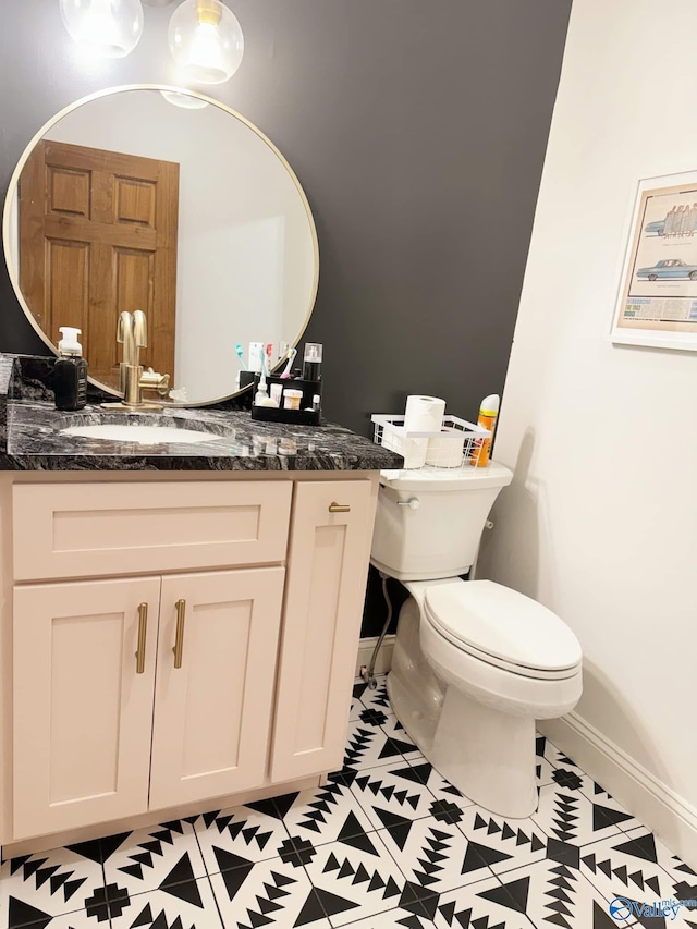 620 County Road 40, Centre, AL 35960 - bathroom with baseboards, vanity, and toilet