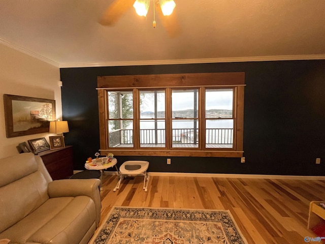 620 County Road 40, Centre, AL 35960 - sitting room featuring ceiling fan, baseboards, crown molding, and wood finished floors