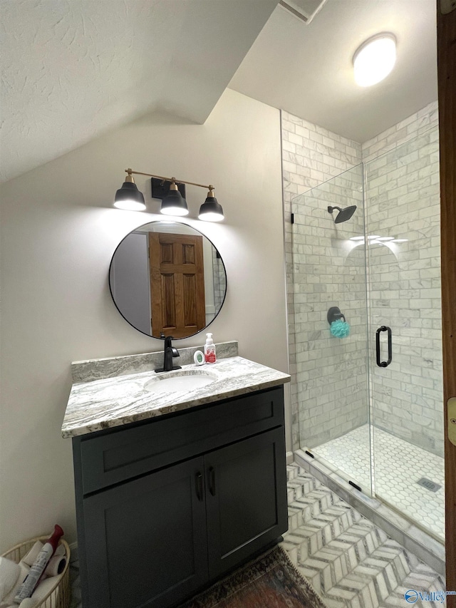 620 County Road 40, Centre, AL 35960 - bathroom with vaulted ceiling, a stall shower, and vanity