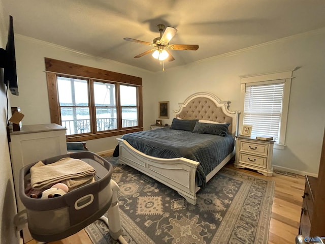 620 County Road 40, Centre, AL 35960 - bedroom with ornamental molding, ceiling fan, light wood-style flooring, and baseboards