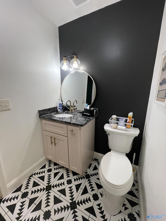 620 County Road 40, Centre, AL 35960 - bathroom featuring tile patterned flooring, baseboards, vanity, and toilet