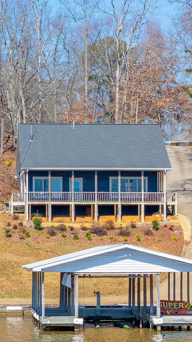 620 County Road 40, Centre, AL 35960 - farmhouse inspired home with a shingled roof, a boat dock, and a water view