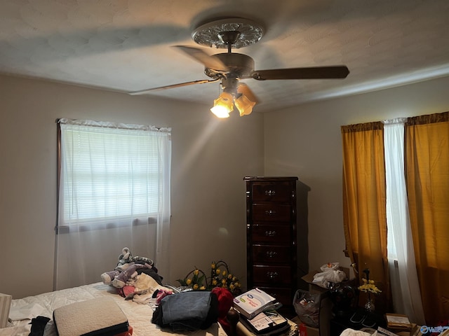 unfurnished bedroom featuring a ceiling fan