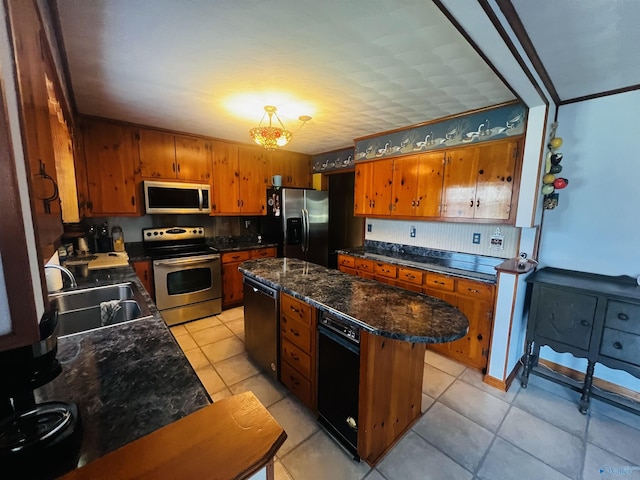 kitchen with a sink, brown cabinets, and stainless steel appliances