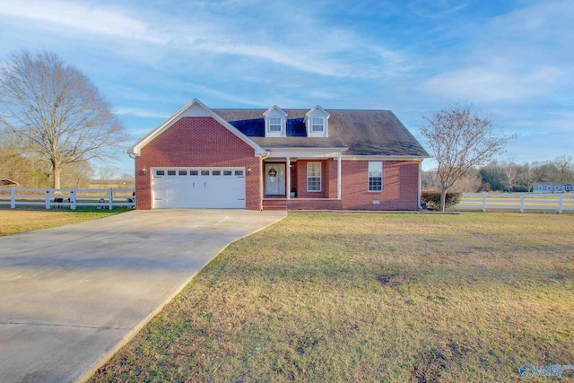 cape cod home featuring a garage and a front yard