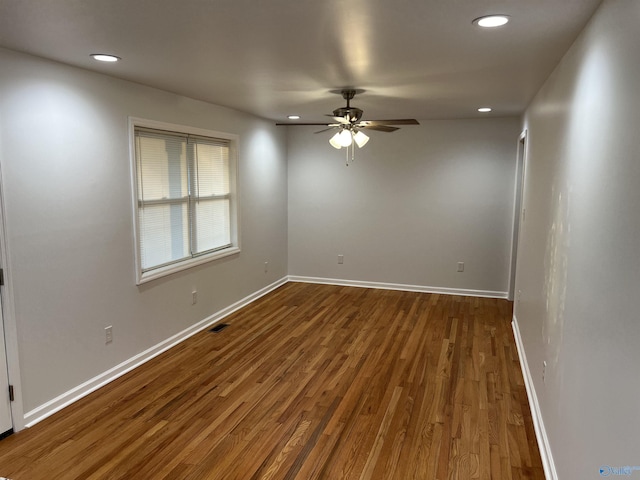 212 Nelson St NW, Hartselle, AL 35640 - unfurnished room featuring ceiling fan and dark hardwood / wood-style floors