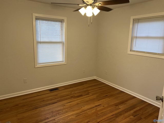 212 Nelson St NW, Hartselle, AL 35640 - empty room with ceiling fan and dark hardwood / wood-style flooring