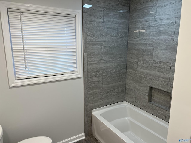 212 Nelson St NW, Hartselle, AL 35640 - bathroom with toilet and tiled shower / bath combo