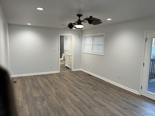 212 Nelson St NW, Hartselle, AL 35640 - unfurnished room with ceiling fan and dark hardwood / wood-style flooring