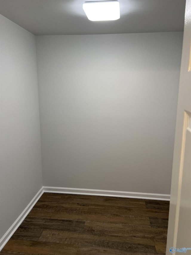 212 Nelson St NW, Hartselle, AL 35640 - empty room with dark hardwood / wood-style floors