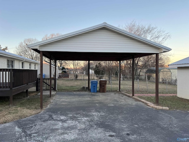 212 Nelson St NW, Hartselle, AL 35640 - parking at dusk with a carport