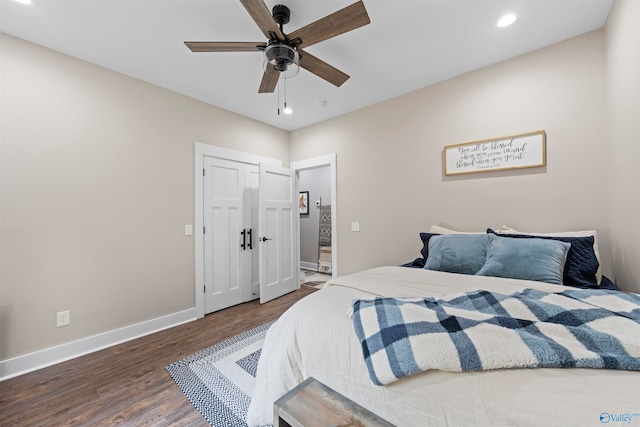 bedroom with ceiling fan and dark hardwood / wood-style floors