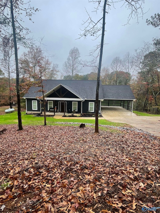 single story home featuring a front yard and a carport