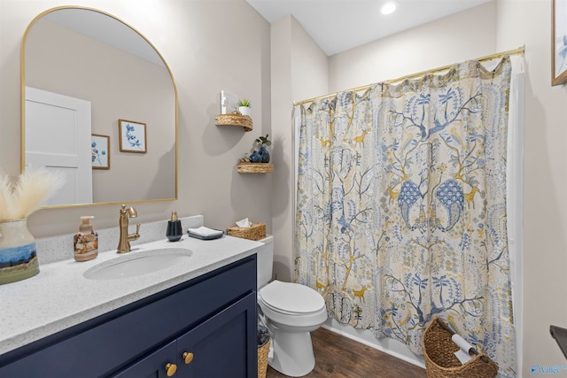 bathroom with a shower with shower curtain, vanity, toilet, and wood-type flooring