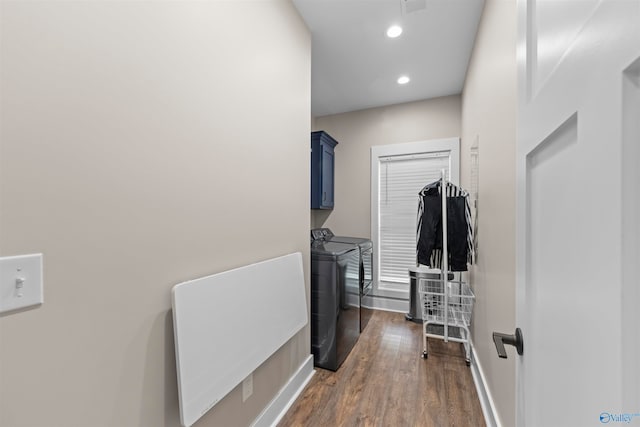 corridor featuring separate washer and dryer and dark wood-type flooring