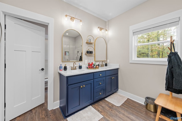 bathroom featuring vanity and hardwood / wood-style flooring