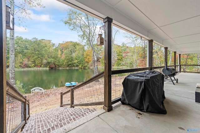 sunroom / solarium with a water view