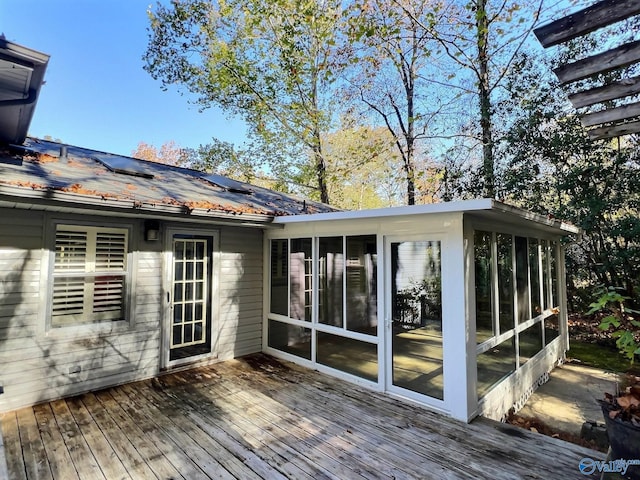 deck with a sunroom