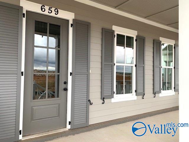 property entrance featuring covered porch