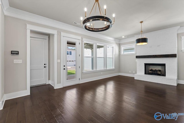 unfurnished living room with a wealth of natural light, ornamental molding, and dark hardwood / wood-style floors