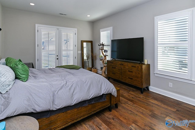 bedroom with french doors, dark hardwood / wood-style floors, and access to outside