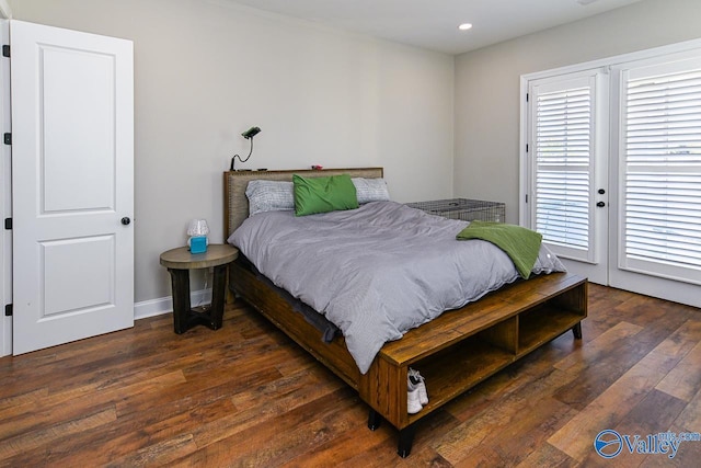 bedroom with dark hardwood / wood-style flooring and access to outside