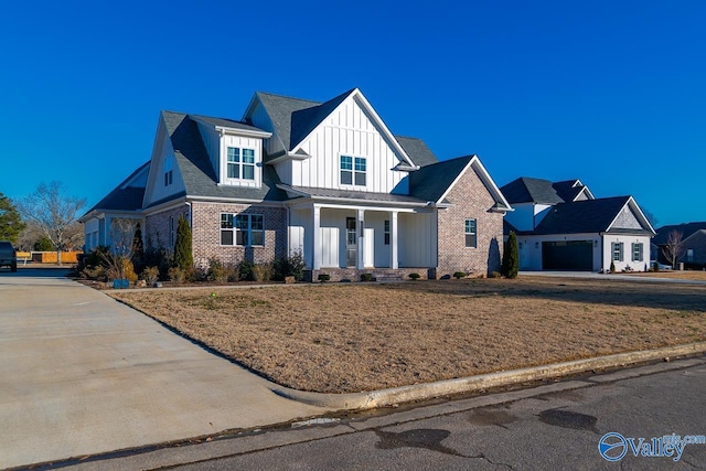 view of front of house featuring a garage and covered porch