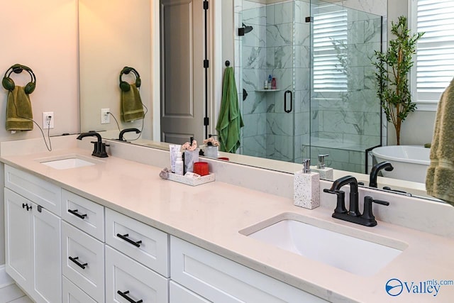 bathroom with vanity and a shower with shower door