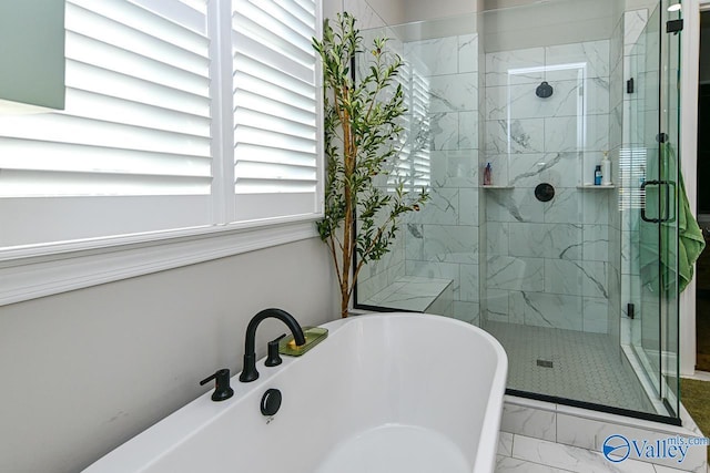 bathroom featuring independent shower and bath