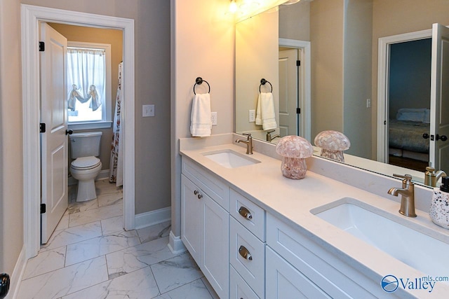 bathroom with vanity and toilet