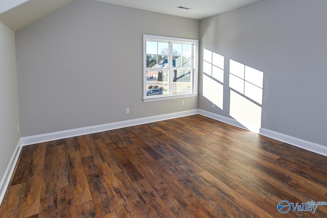 empty room featuring dark hardwood / wood-style flooring