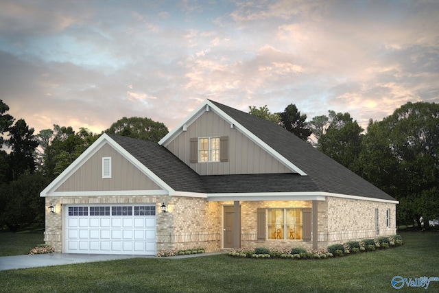 view of front of house with a garage and a yard