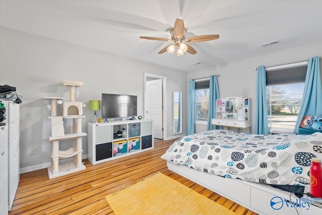 bedroom featuring ceiling fan and light wood-type flooring