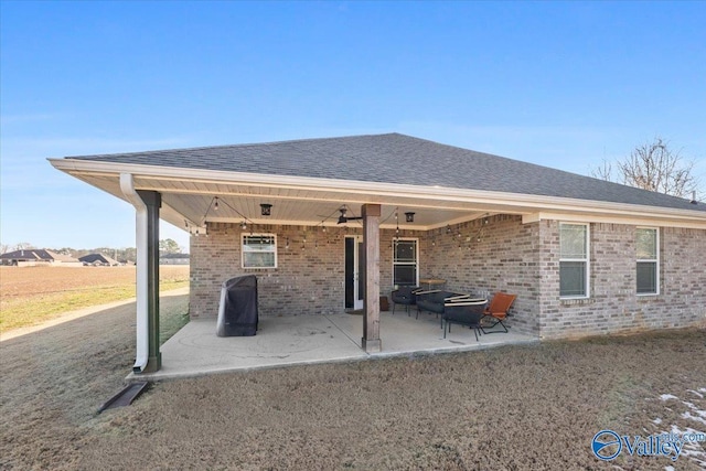 back of property with a patio