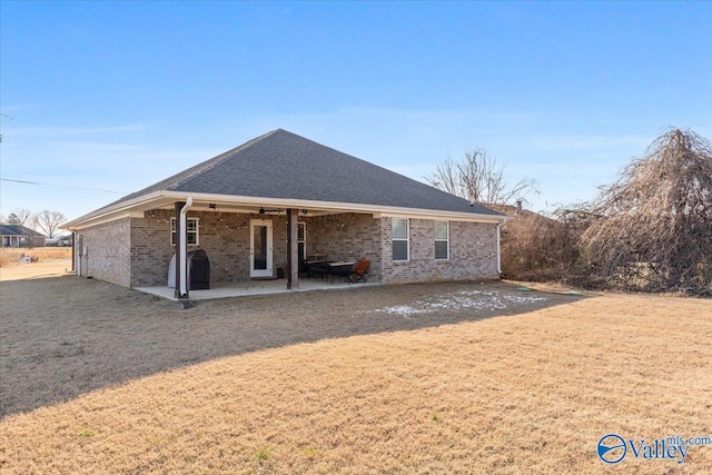 rear view of property featuring a patio